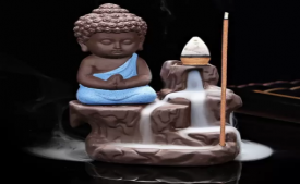 Buy Handcrafted Meditating Little baby Monk Buddha Smoke Backflow Cone Incense Holder Decorative Showpiece - 12 cm  (Polyresin, Multicolor) starting just at Rs 130 only from Flipkart
